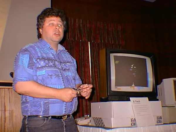 Steve Bjork presenting next to a computer.